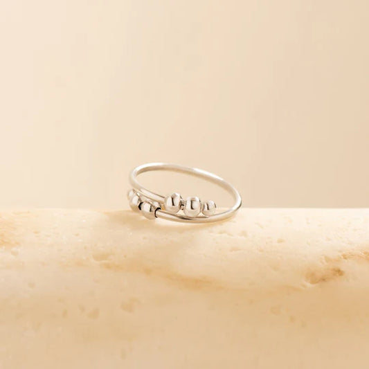 Bague anti-stress réglable en argent à 4 perles